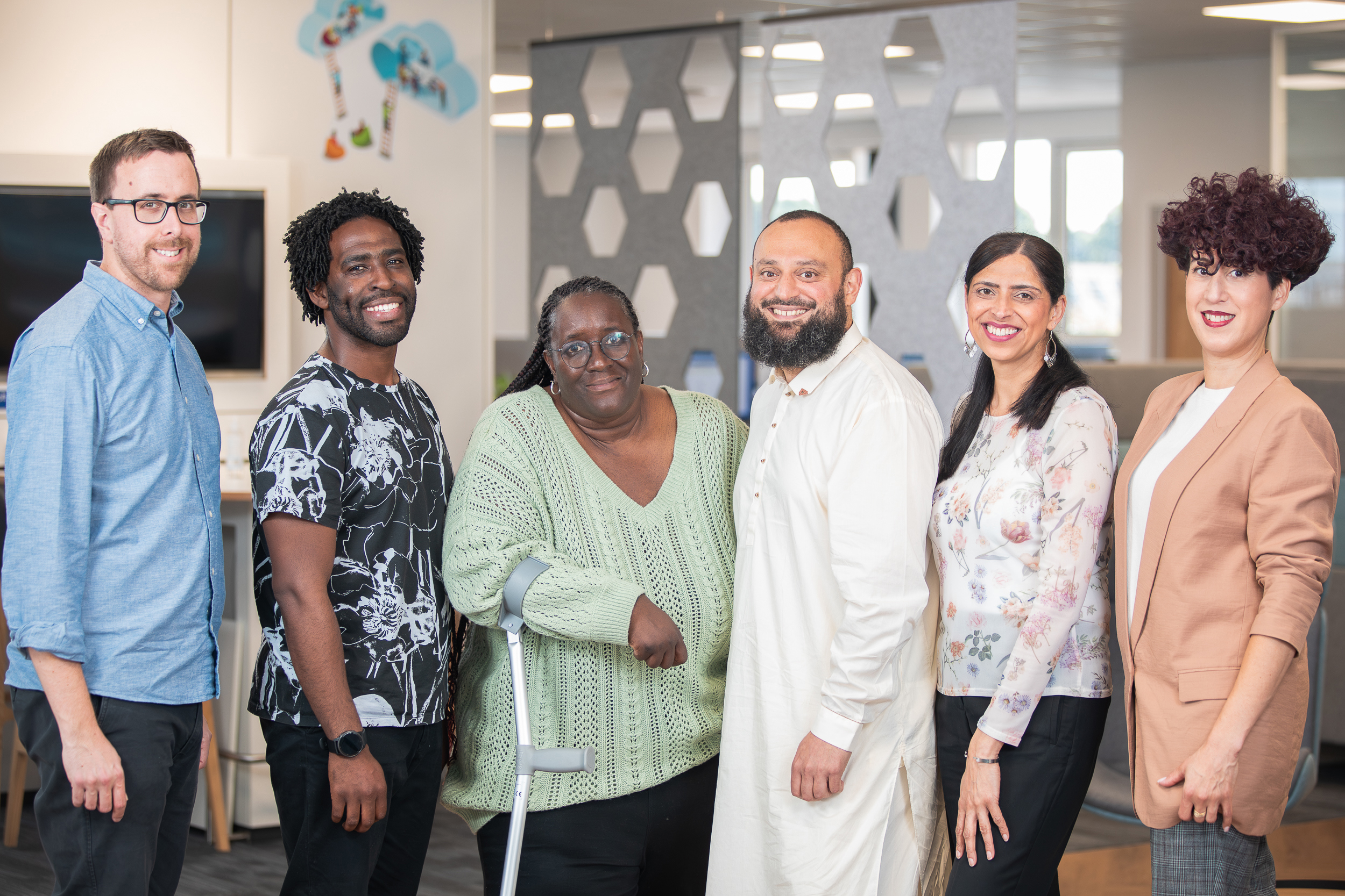 Six Stonewater colleagues stood smiling at camera