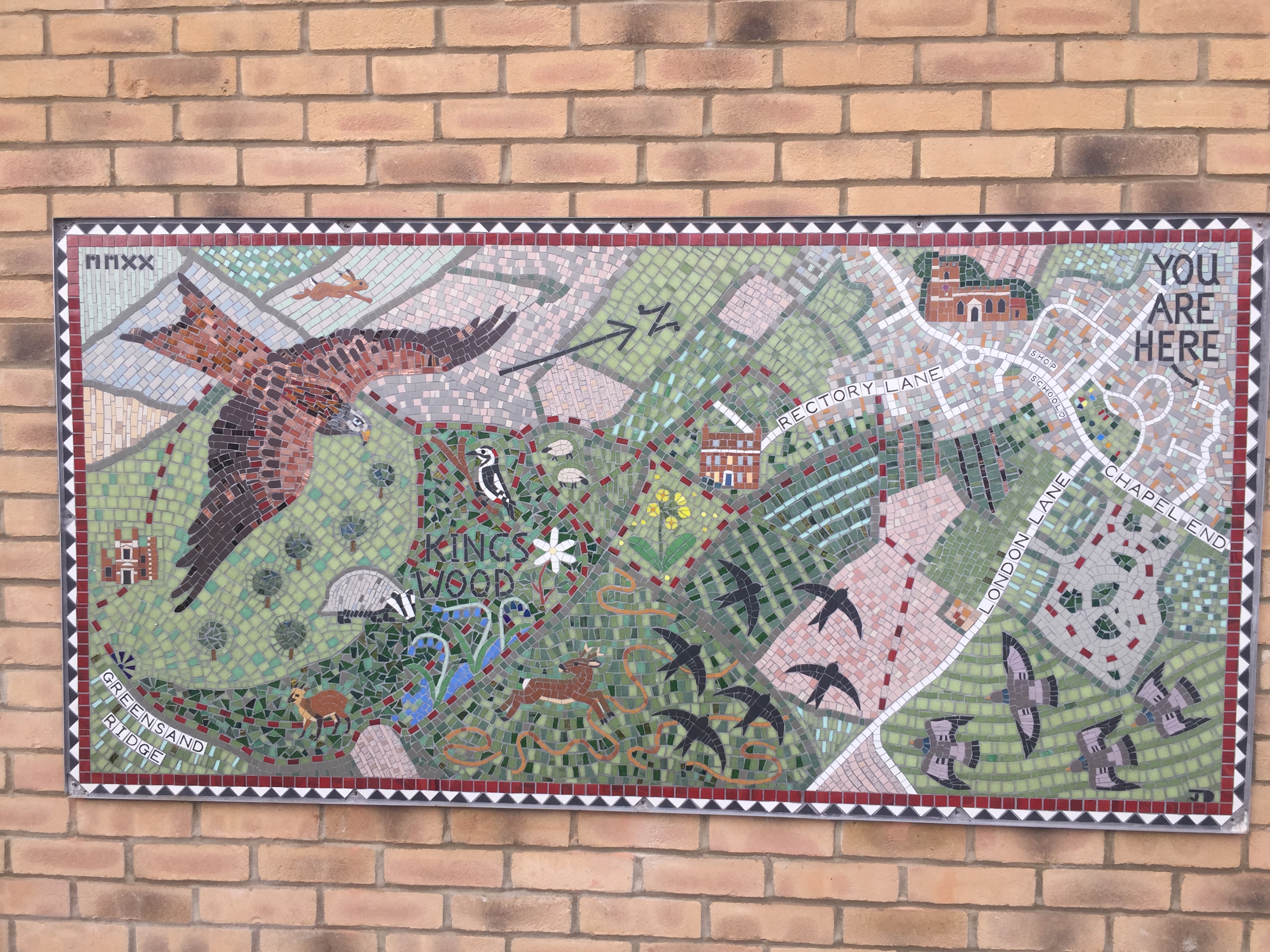 The 44-home scheme had a mosaic map installed on one of the buildings